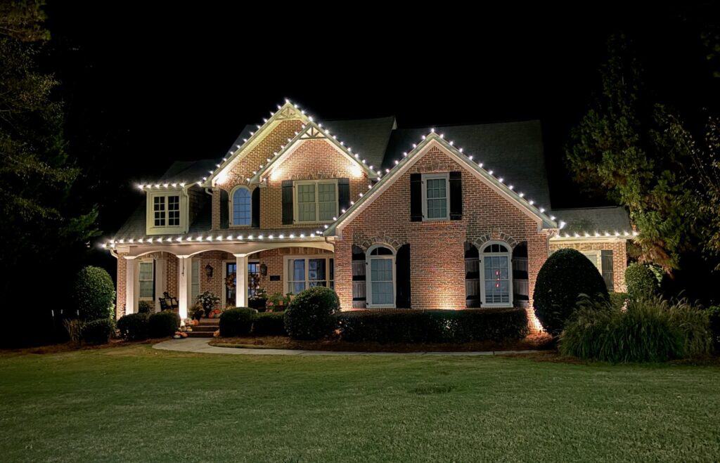 Professional crew working at height for holiday light installation in Utah